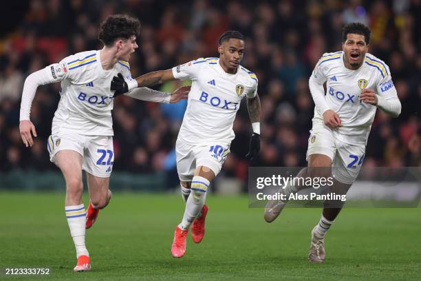 Crysencio Summerville of Leeds United celebrates scoring his team's first goal with Archie Gray and Georginio Rutter during the Sky Bet Championship...