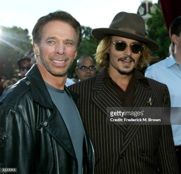 Director Jerry Bruckheimer and actor Johnny Depp attend the film premiere of "Pirates of the Caribbean" at Disneyland on June 28, 2003 in Anaheim,...