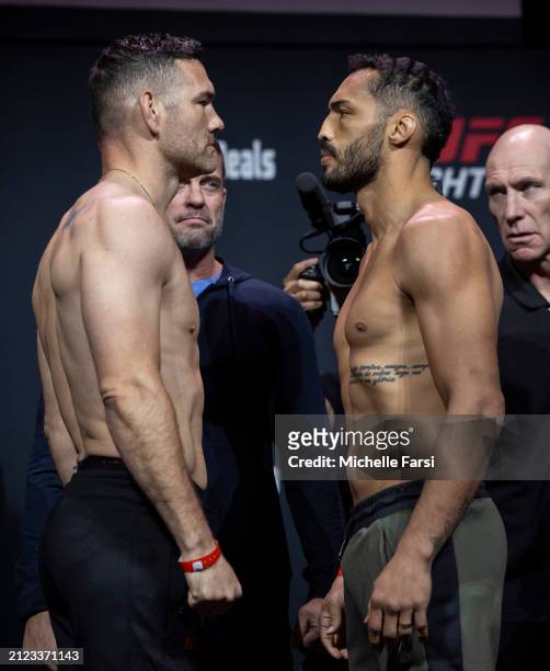 Chris Weidman and Bruno Silva face off after weighing in prior to their fight at Boardwalk Hall Arena on March 29, 2024 in Atlantic City, New Jersey.
