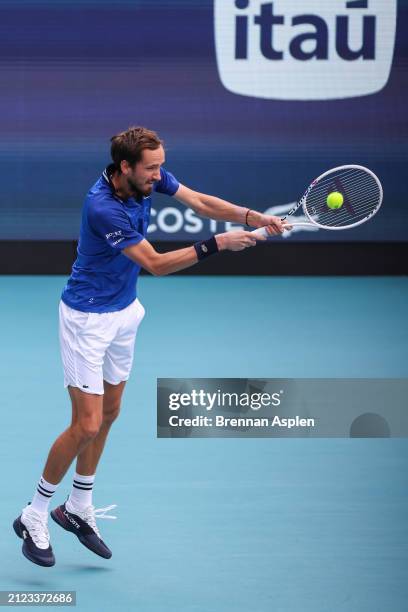 Daniil Medvedev hits a shot against Jannik Sinner of Italy during the Men's semifinal on Day 14 of the Miami Open at Hard Rock Stadium on March 29,...