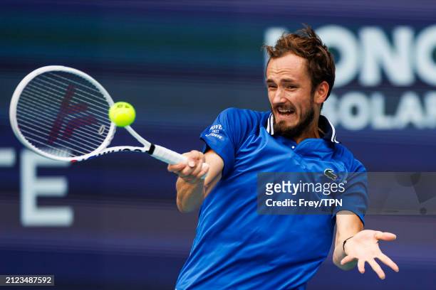 Daniil Medvedev of Russia hits a forehand against Jannik Sinner of Italy in the semi-final of the Miami Open at the Hard Rock Stadium on March 29,...