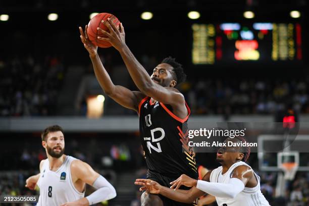 Gabe Olaseni of London Lions is challenged by TJ Shorts of Paris Basketball in the third quarter during the Euro Cup Finals match between London...