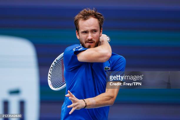 Daniil Medvedev of Russia hits a forehand against Jannik Sinner of Italy in the semi-final of the Miami Open at the Hard Rock Stadium on March 29,...