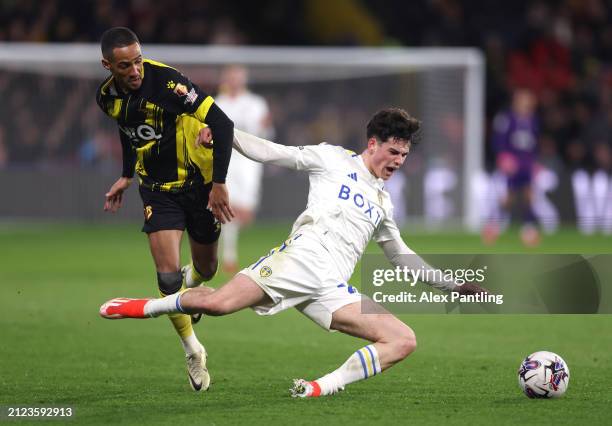 Archie Gray of Leeds United is challenged by Thomas Ince of Watford during the Sky Bet Championship match between Watford and Leeds United at...