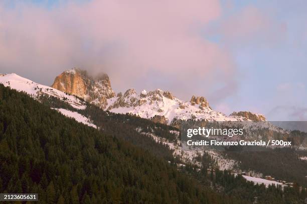 scenic view of snowcapped mountains against sky,soraga di fassa,italy - soraga stock pictures, royalty-free photos & images
