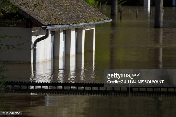 This photograph taken on April 1 shows a view of a flooded area of the camping site due to the overflowing of the Vienne River, in Chinon, western...