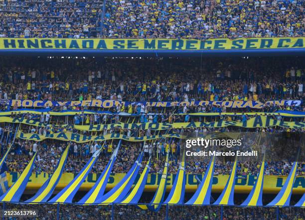Fans of Boca Juniors cheer for their team during a group B match between Boca Juniors and San Lorenzo at Estadio Alberto J. Armando on March 30, 2024...