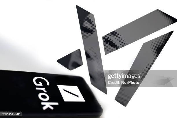 The Grok logo is being displayed on a smartphone with Xai visible in the background in this photo illustration in Brussels, Belgium, on April 1, 2024.