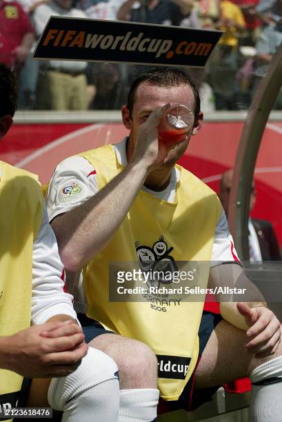June 10: Wayne Rooney of England hides his face drinking before the FIFA World Cup Finals 2006 Group B match between England and Paraguay at...