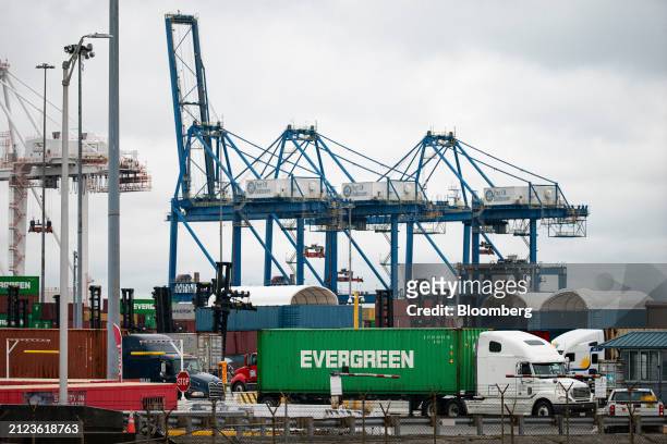 Tractor-trailer truck and shipping containers at the Seagirt Marine Terminal at the Port of Baltimore in Baltimore, Maryland, US, on Monday, April 1,...