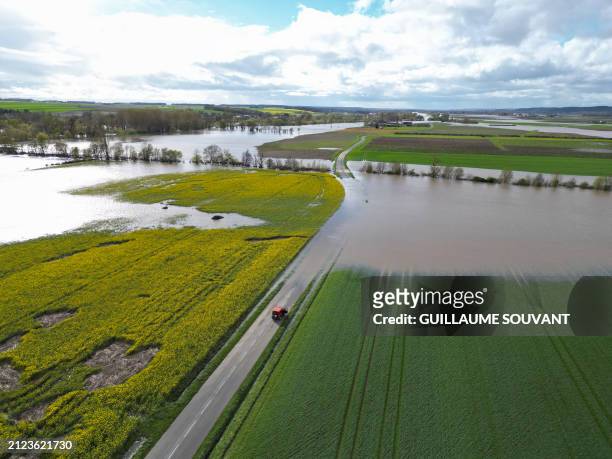 This aerial photograph taken on April 1 shows a car stopped along a road between flooded fields, during the overflowing of the Vienne River, in...