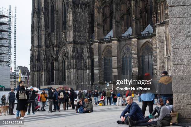 Cannabis enthusiasts are gathering at Roncalliplatz and celebrating by smoking freely in Cologne, Germany, on April 1 as Germany puts a new cannabis...