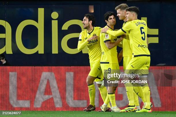 Villarreal's Norwegian forward Alexander Sorloth celebrates with teammates after scoring his team's first goal during the Spanish League football...