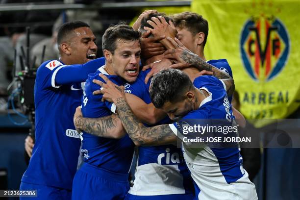 Atletico Madrid's Spanish midfielder Saul Niguez celebrates with teammates after scoring his team's second goal during the Spanish League football...