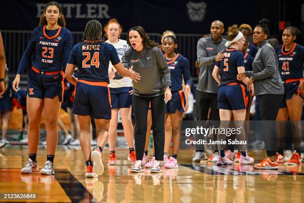 Head coach Shauna Green of the Illinois Fighting Illini greets players as they head toward the bench during a break in the second half of a WBIT...