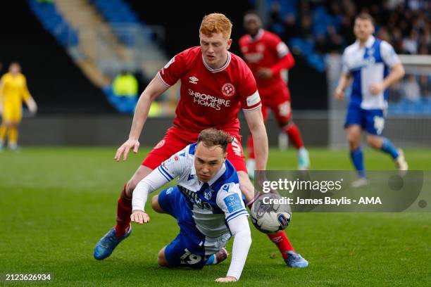 Morgan Feeney of Shrewsbury Town and Harvey Vale of Bristol Rovers during the Sky Bet League One match between Bristol Rovers and Shrewsbury Town at...