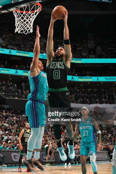 Jayson Tatum of the Boston Celtics dunks the ball during the game against the Charlotte Hornets on April 1, 2024 at Spectrum Center in Charlotte,...
