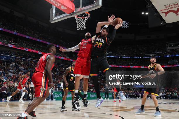 Jusuf Nurkic of the Phoenix Suns rebounds the ball during the game against the New Orleans Pelicans on April 1, 2024 at the Smoothie King Center in...