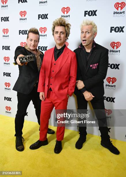 Tré Cool, Billie Joe Armstrong and Mike Dirnt of Green Day, winners of the Landmark Award, pose in the press room at the 2024 iHeartRadio Music...