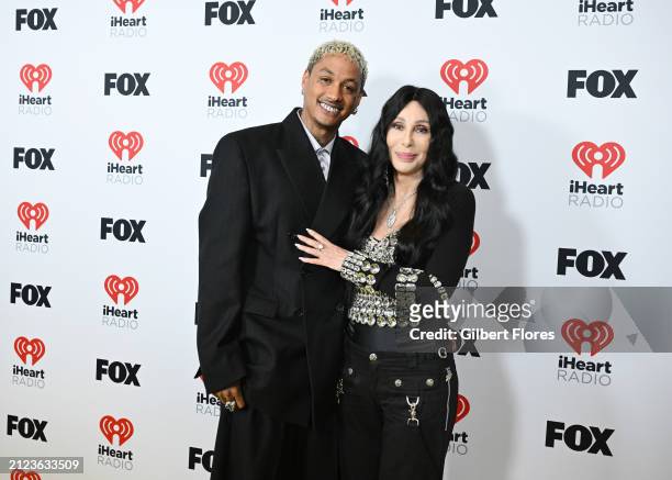 Alexander "AE" Edwards and Cher, winners of the Icon award, pose in the press room at the 2024 iHeartRadio Music Awards held at the Dolby Theatre on...