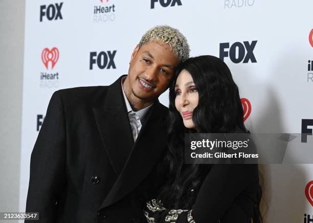 Alexander "AE" Edwards and Cher, winner of the Icon award, pose in the press room at the 2024 iHeartRadio Music Awards held at the Dolby Theatre on...