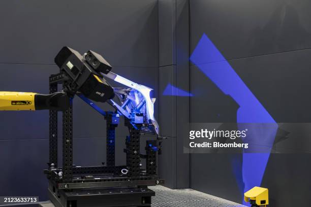 Robotic arm on the production line at the Volkswagen Anhui Automotive Co. Factory in Hefei, Anhui Province, China, on Thursday, March 28, 2024....