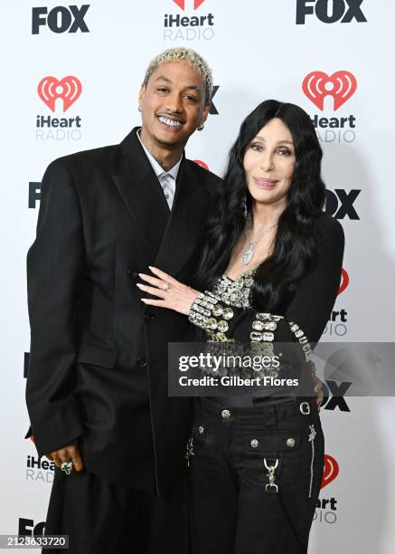 Alexander "AE" Edwards and Cher, winners of the Icon award, pose in the press room at the 2024 iHeartRadio Music Awards held at the Dolby Theatre on...