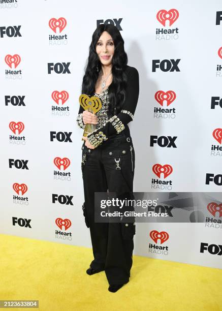 Cher, winner of the Icon award, pose in the press room at the 2024 iHeartRadio Music Awards held at the Dolby Theatre on April 1, 2024 in Los...