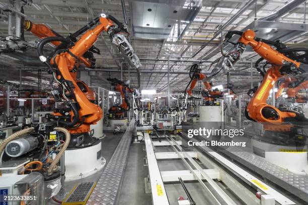 Robotic arms on the production line at the Volkswagen Anhui Automotive Co. Factory in Hefei, Anhui Province, China, on Thursday, March 28, 2024....