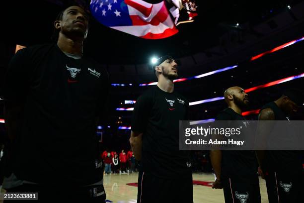 Alex Caruso of the Chicago Bulls stands for the National Anthem before the game against the Atlanta Hawks on April 1, 2024 at United Center in...
