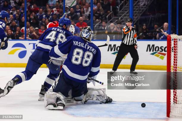 David Perron of the Detroit Red Wings scores a goal against goalie Andrei Vasilevskiy and the Tampa Bay Lightning at Amalie Arena on April 1, 2024 in...