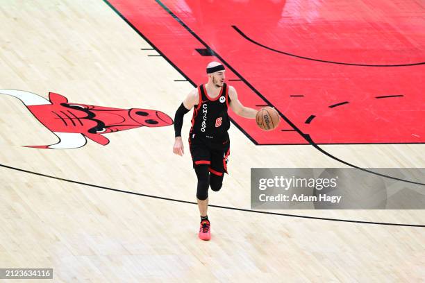 Alex Caruso of the Chicago Bulls dribbles the ball during the game against the Atlanta Hawks on April 1, 2024 at United Center in Chicago, Illinois....