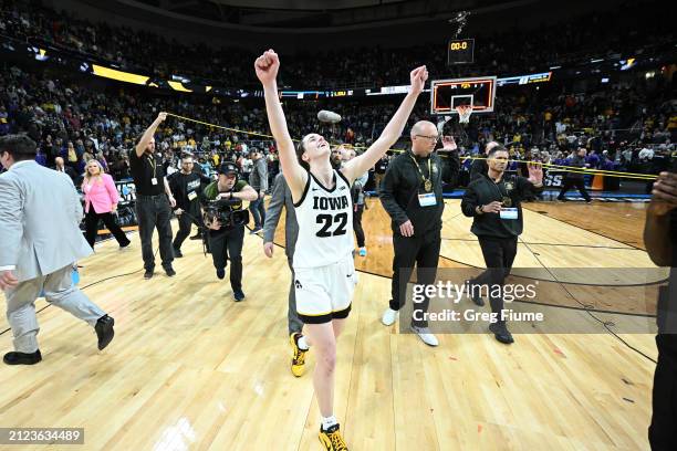 Caitlin Clark of the Iowa Hawkeyes celebrates on the court after defeating the LSU Tigers during the Elite Eight round of the 2024 NCAA Women's...