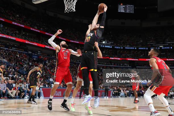 Jusuf Nurkic of the Phoenix Suns drives to the basket during the game New Orleans Pelicans on April 1, 2024 at the Smoothie King Center in New...