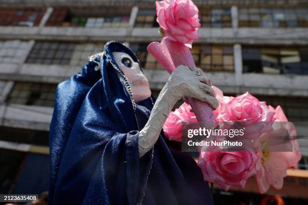Dozens of people are attending a gathering outside the Santa Muerte shrine in Tepito, Mexico City, to express their gratitude for the favors granted...