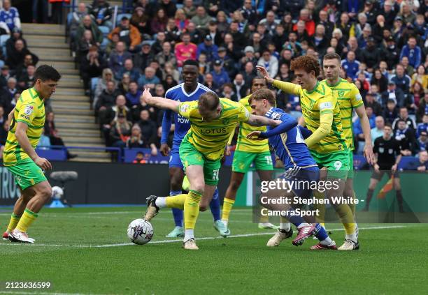 Norwich City's Ashley Barnes and Josh Sargent defend against Leicester City's Kiernan Dewsbury-Hall during the Sky Bet Championship match between...