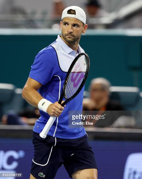 Grigor Dimitrov of Bulgaria celebrates the win of the first set against Alexander Zverev of Germany during the Men's semifinal at Hard Rock Stadium...