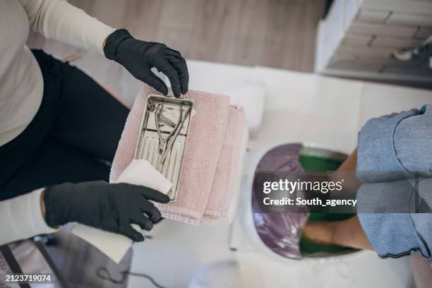 professional pedicure tools sterilization process - nail salon stock pictures, royalty-free photos & images