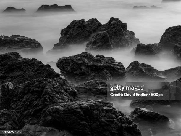 panoramic view of rocks in sea against sky,malibu,california,united states,usa - malibu nature stock pictures, royalty-free photos & images