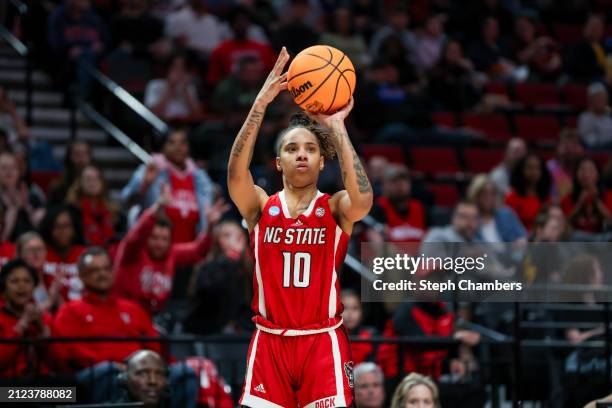 Aziaha James of the NC State Wolfpack shoots a three point basket during the second half against the Stanford Cardinal in the Sweet 16 round of the...