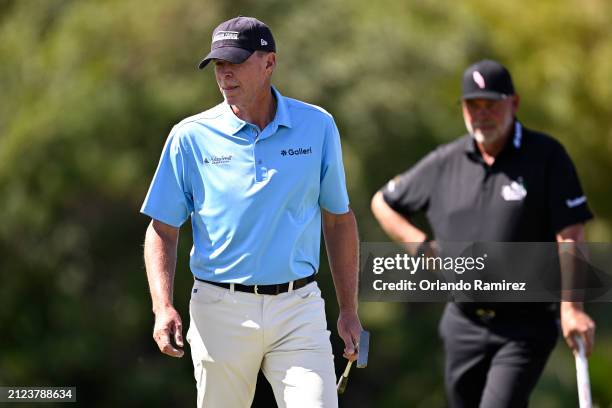 Steve Stricker of the United States, left, looks on ahead of Darren Clarke of Northern Ireland on the fifth green during the first round of The...