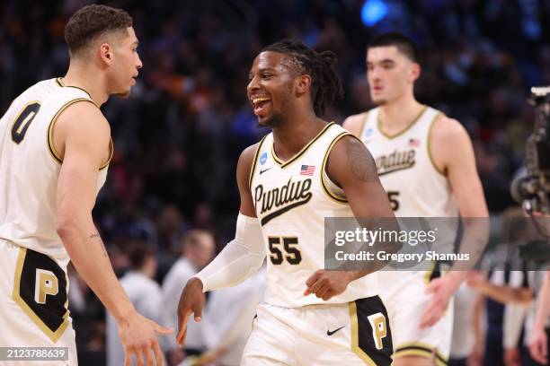 Lance Jones of the Purdue Boilermakers celebrates with teammates during the second half against the Gonzaga Bulldogs in the Sweet 16 round of the...