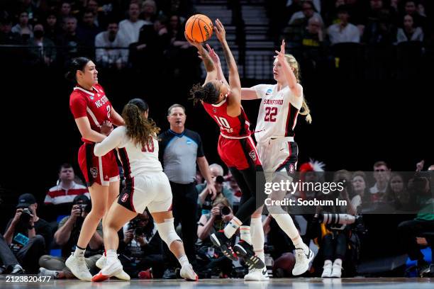 Cameron Brink of the Stanford Cardinal fouls Aziaha James of the NC State Wolfpack during the second half in the Sweet 16 round of the NCAA Women's...