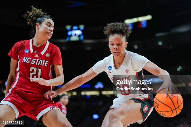 Madison Hayes of the NC State Wolfpack defends Talana Lepolo of the Stanford Cardinal during the second half in the Sweet 16 round of the NCAA...