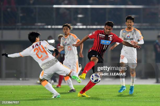 Jonathan Reis of Consadole Sapporo and Chikashi Masuda during the J.League YBC Levain Cup Group C match between Hokkaido Consadole Sapporo and...