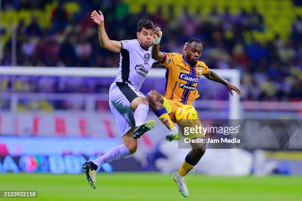 Nestor Araujo of America fights for the ball with Franck Boli of San Luis during the 13th round match between America v Atletico San Luis as part of...