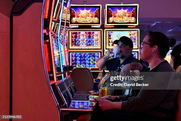 People play gaming machines inside the Tropicana Las Vegas on March 29 in Las Vegas, Nevada. The hotel-casino opened in 1957 and will close on April...