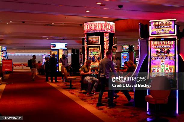 People play gaming machines inside the Tropicana Las Vegas on March 29 in Las Vegas, Nevada. The hotel-casino opened in 1957 and will close on April...