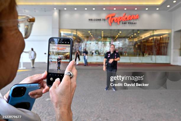 People take photos of themselves at one of the entrances at the Tropicana Las Vegas on March 29 in Las Vegas, Nevada. The hotel-casino opened in 1957...