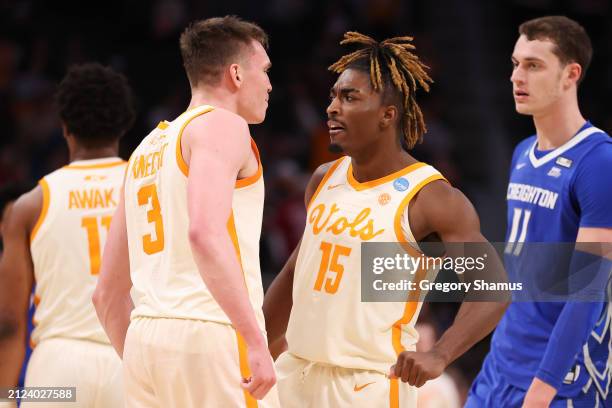 Jahmai Mashack of the Tennessee Volunteers reacts with Dalton Knecht during the second half against the Creighton Bluejays in the Sweet 16 round of...